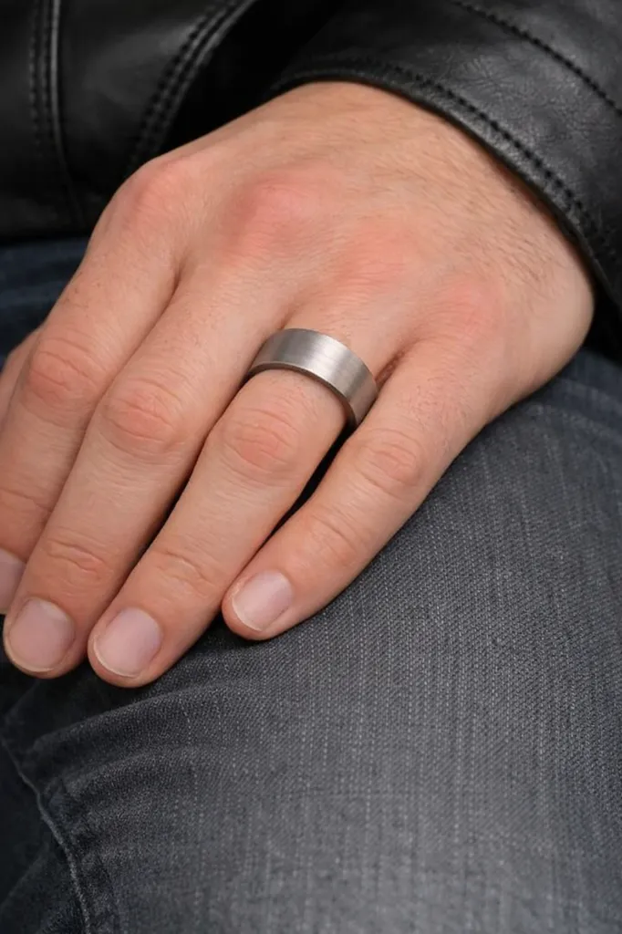 brushed-finish-flat-tungsten-carbide-ring-on-hand.webp