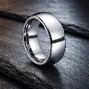 polished-finish-domed-tungsten-carbide-ring-on-surface.webp