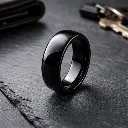 polished-black-tungsten-ring-domed-on-slate.webp
