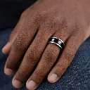 black-tungsten-ring-beleved-edges-polished-on-hand.webp