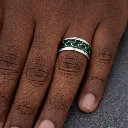 tungsten-ring-with-inlay-carbon-fiber-green-center-on-hand.webp
