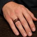 8mm-mens-koa-wood-tungsten-ring-on-hand.webp