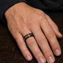 8mm-whiskey-barrel-koa-wood-tungsten-ring-on-hand.webp